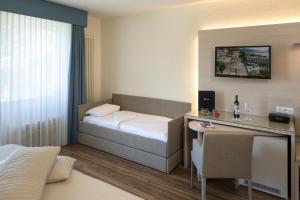 Voodi või voodid majutusasutuse Hotel Campione toas