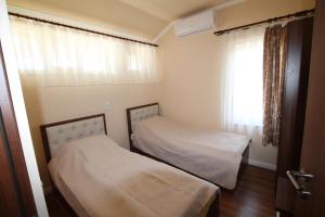 Postel nebo postele na pokoji v ubytování Casa Camelia Felix