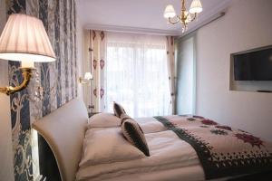 Posteľ alebo postele v izbe v ubytovaní VIP Apartamenty POD KROKWIĄ SPA