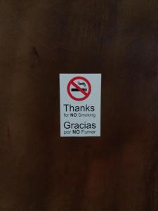 a sign that says thanks for no smokingacers for no turn at Adanesne Apartments in Ensenada