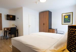 Postel nebo postele na pokoji v ubytování Hotel Vila Tina