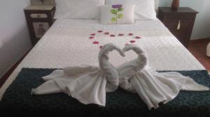 A bed or beds in a room at La Casa del Telar