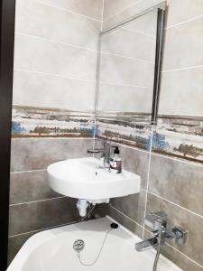 a bathroom with a sink and a toilet at Apartment - Matusevycha Street 2-11 in Kryvyi Rih