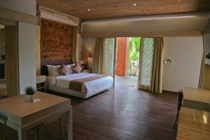 Ein Bett oder Betten in einem Zimmer der Unterkunft Grand Mega Resort & Spa