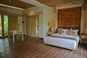 Ein Bett oder Betten in einem Zimmer der Unterkunft Grand Mega Resort & Spa