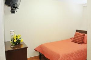 Postel nebo postele na pokoji v ubytování Hotel Margarita 2