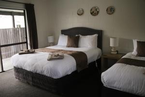 Postel nebo postele na pokoji v ubytování Mackenzie Motels