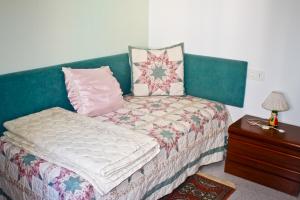 Säng eller sängar i ett rum på La CasetA