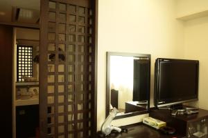 TV a/nebo společenská místnost v ubytování Hotel New Takada + 3 fotografie