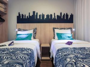 Cama ou camas em um quarto em Mercure Sao Paulo Pinheiros