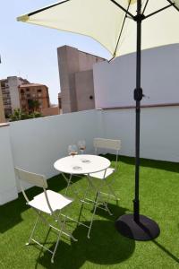 Patio lub wspólna przestrzeń na świeżym powietrzu w obiekcie Letmalaga Cappuccino