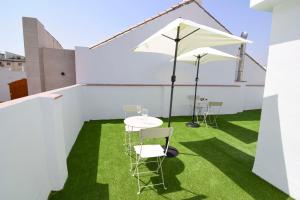 Patio lub wspólna przestrzeń na świeżym powietrzu w obiekcie Letmalaga Cappuccino