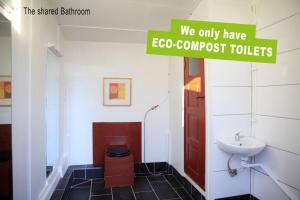 a bathroom with a toilet and a sink at Mormors Bakeri – B&B in Asarum +40 photos