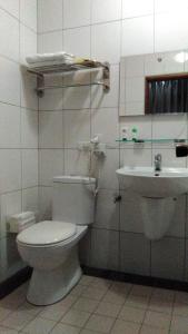 a bathroom with a toilet and a sink at 社長的家 in Luodong