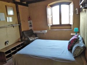 A bed or beds in a room at La Toscana
