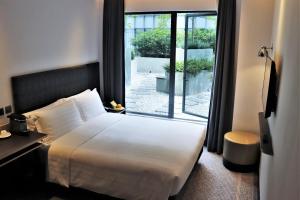 Voodi või voodid majutusasutuse Camlux Hotel toas +32 fotot