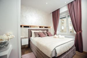 Posteľ alebo postele v izbe v ubytovaní Citylux Apartments
