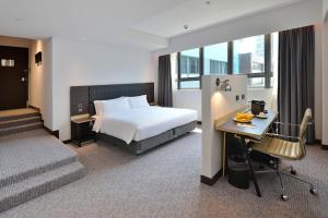 Voodi või voodid majutusasutuse Camlux Hotel toas