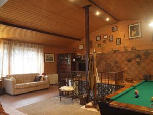 a living room with a pool table in it at Chalet Gea in Milo