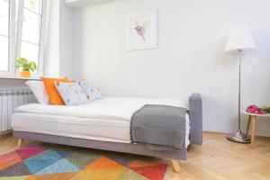Posteľ alebo postele v izbe v ubytovaní Bright and modern apartment in the heart of the Old and New Town