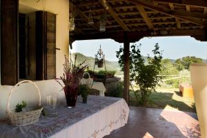 a table with a white table cloth on a patio at Ca' Amorino in Galzignano