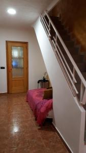 Postel nebo postele na pokoji v ubytování Casa Pueblo Alzira No Compartida