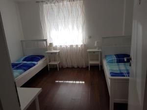 Postel nebo postele na pokoji v ubytování Gästehaus Ditz