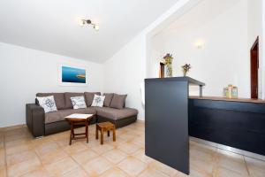 a living room with a couch and a table at Villa Divna in Zaboric +31 photos