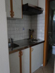 a kitchen with a sink and a counter top at Zele in Dolac +33 photos