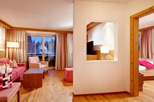 Postel nebo postele na pokoji v ubytování Biohotel Castello Königsleiten
