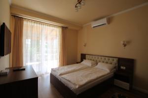 Postel nebo postele na pokoji v ubytování Casa Camelia Felix