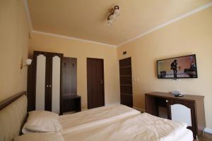 Postel nebo postele na pokoji v ubytování Casa Camelia Felix