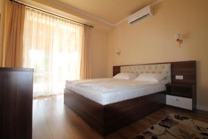 Postel nebo postele na pokoji v ubytování Casa Camelia Felix