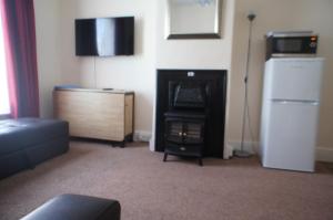 TV a/nebo společenská místnost v ubytování No. 2 Smith Cottages