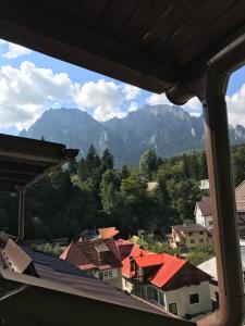 a view of a town with mountains in the background at Garsoniera Studio in Buşteni +4 photos