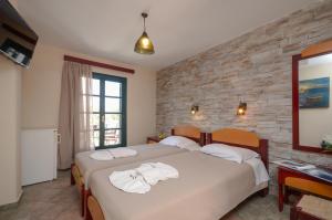 Postelja oz. postelje v sobi nastanitve Hotel Naxos Beach