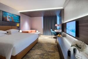 Voodi või voodid majutusasutuse Emerald Hotel toas