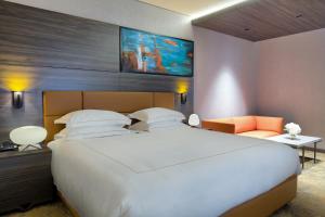 Voodi või voodid majutusasutuse Emerald Hotel toas