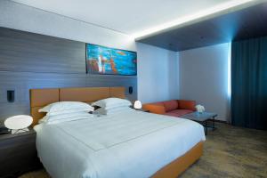 Voodi või voodid majutusasutuse Emerald Hotel toas