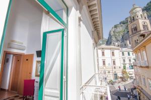 a balcony with a view of a city at Hotel Fontana in Amalfi