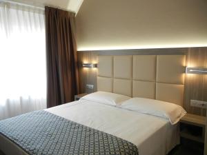 Letto o letti in una camera di Delle Nazioni Milan Hotel