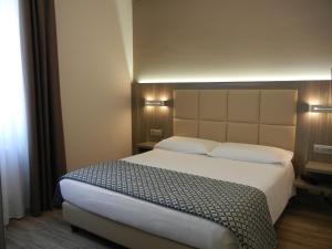 
Letto o letti in una camera di Delle Nazioni Milan Hotel
