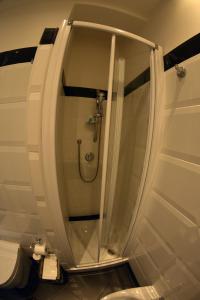 a glass shower in a bathroom with a toilet at Petit Bijou de Rome Vatican-Trastevere in Rome +22 photos