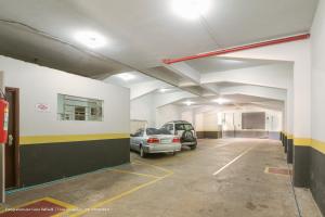 a parking garage with a car parked in it at Hotel Princeton in Piracicaba