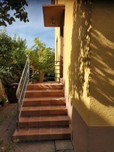 a stairway leading up to a building with a shadow at Lovely Studio in Cannstatt in Stuttgart