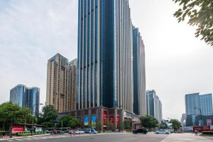 a city street with tall buildings in a city at Chengdu Hi - Tech·Global Center Locals Apartment 00139620 in Chengdu