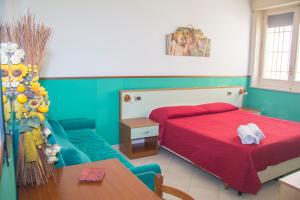 Villa Speranza tesisinde bir odada yatak veya yataklar