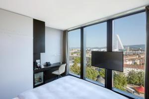 a hotel room with a view of the ocean at Hyperion Hotel Basel in Basel