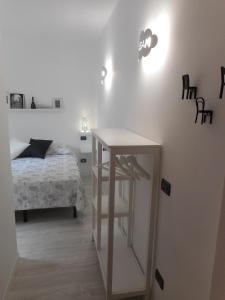 Postel nebo postele na pokoji v ubytování Borgo Antico Rooms Self Check-in