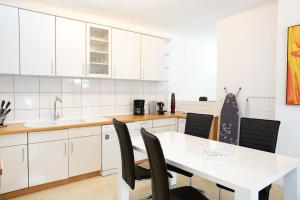 Kuchyň nebo kuchyňský kout v ubytování Holidayapartment Rüsselsheim + 37 fotografií
